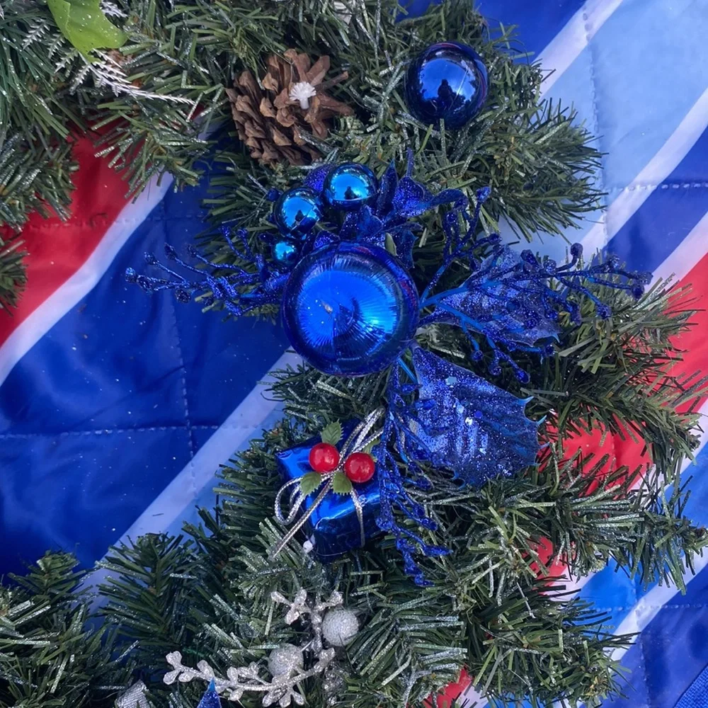 Evergreen Wreath Trimmed with silver and blue and pine ones